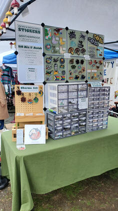 10x10 tent, sticker table - Thrift-a-Bull Market 2025 10x10 tent, sticker table - Thrift-a-Bull Market 2025